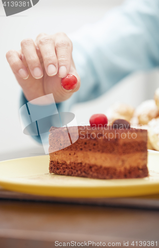 Image of Woman preparing chocolate cake