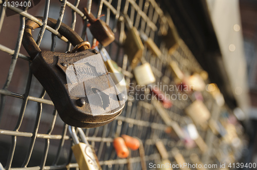 Image of Locks on a bridge railing