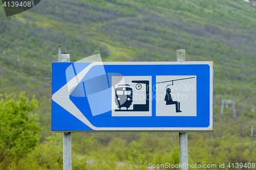 Image of Train station and ski lift signs