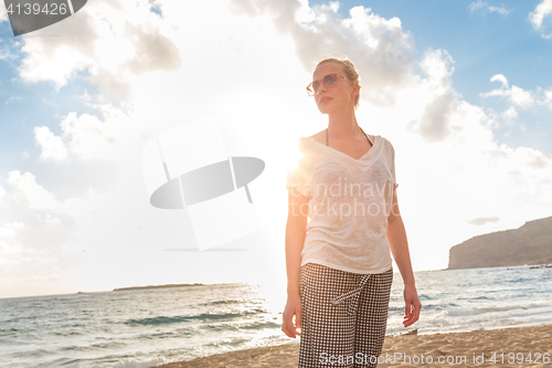 Image of Relaxed Happy Woman Enjoying Sun on Vacations.