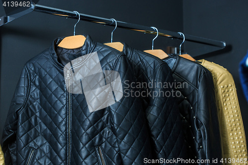 Image of fashion jacket on hangers