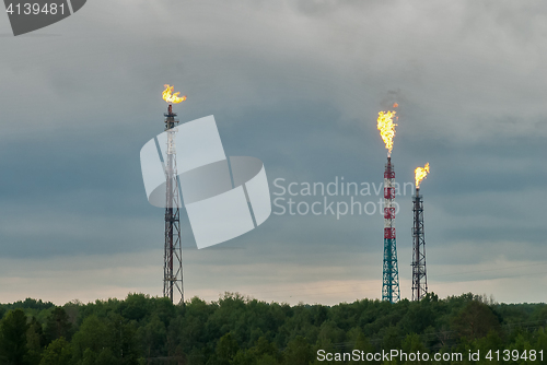 Image of Torches for burning of associated gas of oil plant