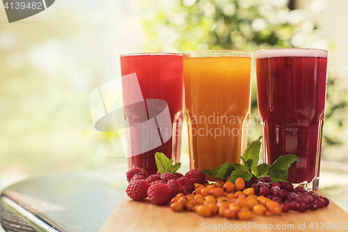 Image of fruit drink with cranberries raspberries and sea buckthorn