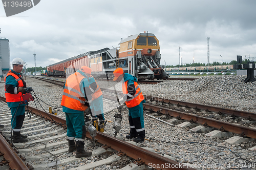 Image of Railway workers repairing rail