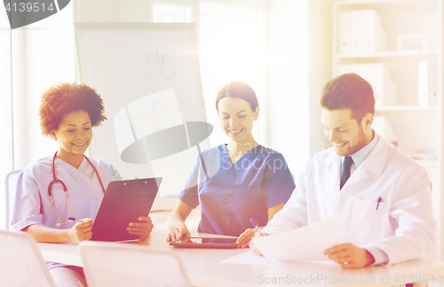 Image of group of happy doctors meeting at hospital office