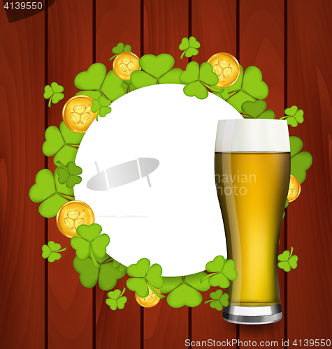 Image of Greeting card with glass of light beer, shamrocks and golden coi