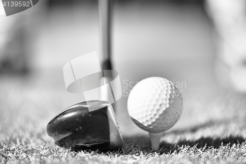 Image of Golf club and ball