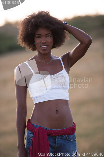 Image of young black woman in nature