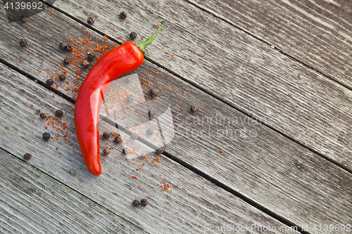 Image of Red hot chili peppers on wood