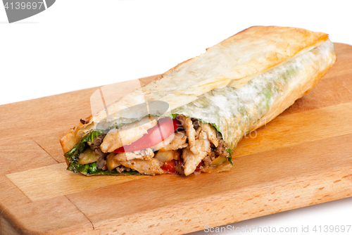 Image of chicken burrito with fried potato and tomato