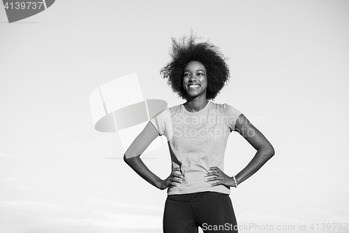 Image of Portrait of a young african american woman running outdoors