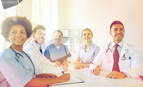 Image of group of happy doctors meeting at hospital office