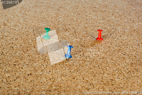 Image of Thumbtack pins on pinboard