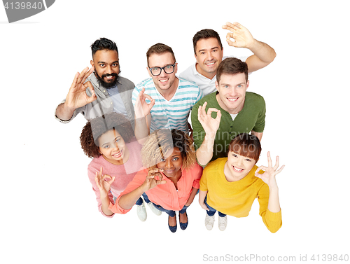 Image of international group of happy people showing ok