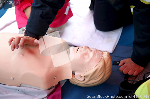 Image of Practicing CPR chest compressioon on a dummy