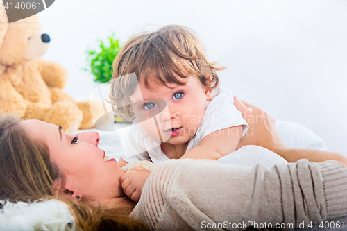 Image of Happy woman with son - baby boy
