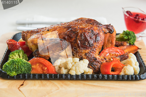 Image of Roasted chicken with vegetables.