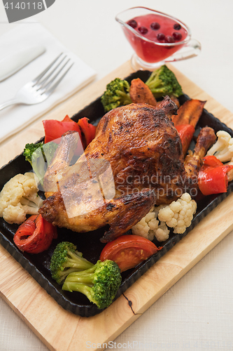 Image of Roasted chicken with vegetables.