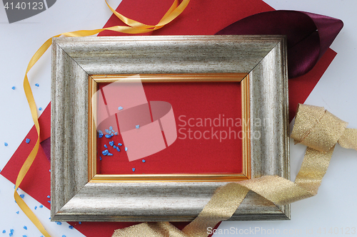 Image of Decorated frame with red paper