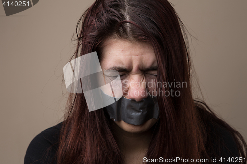 Image of Woman hostage with gray tape