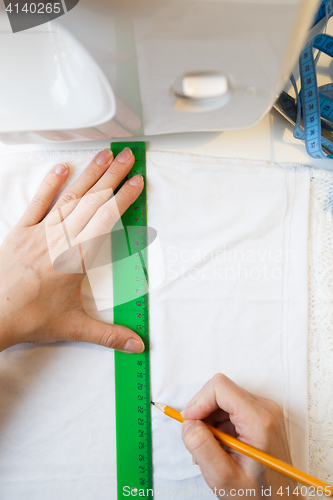 Image of Woman making pattern top view