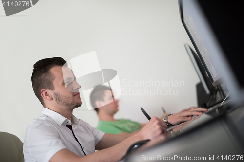 Image of a group of graphic designers at work