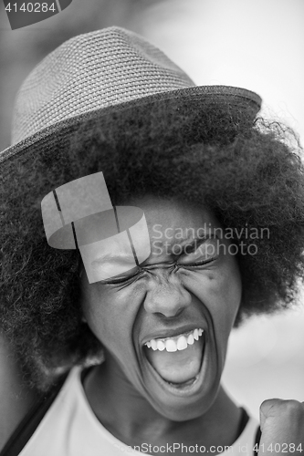 Image of Close up portrait of a beautiful young african american woman sm