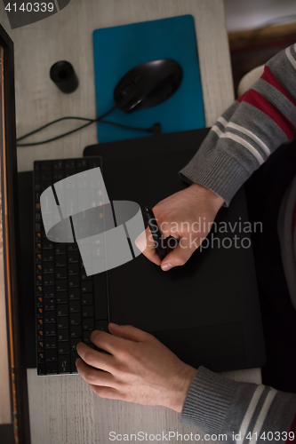 Image of graphic designer at work top view