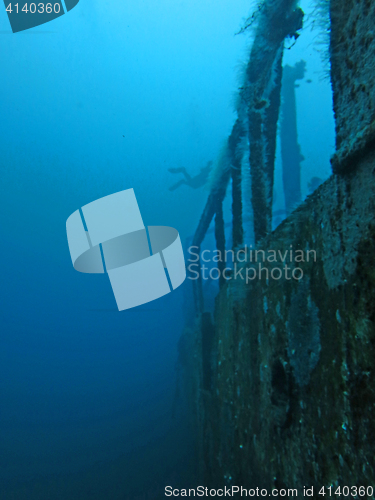 Image of massive shipwreck, sits on a sandy seafloor in bali