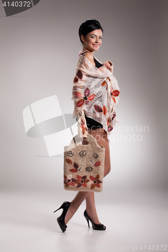 Image of Young Beautiful Woman in Fashionable Clothing