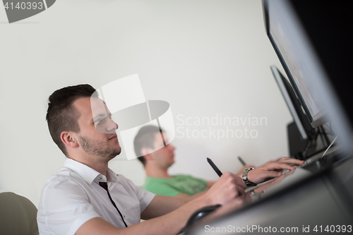 Image of a group of graphic designers at work