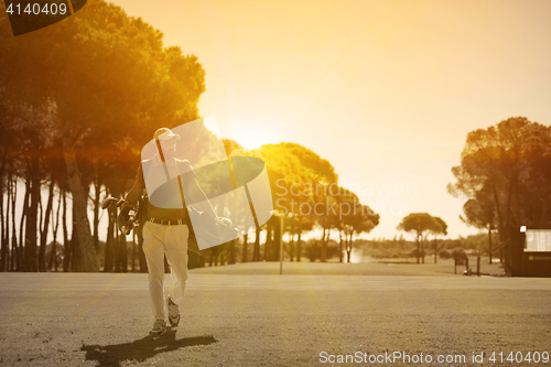 Image of handsome middle eastern golf player at the course