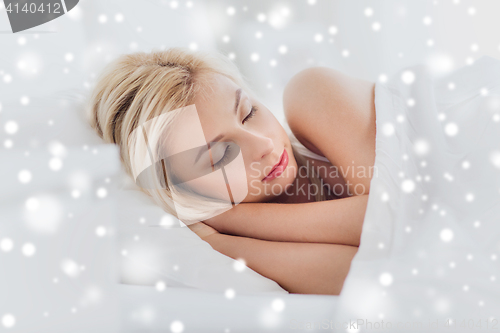 Image of young woman sleeping in bed at home bedroom