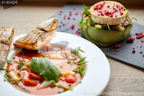 Image of goat cheese salad and gazpacho soup at restaurant