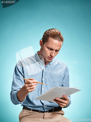 Image of Smart sad student with sheets of paper