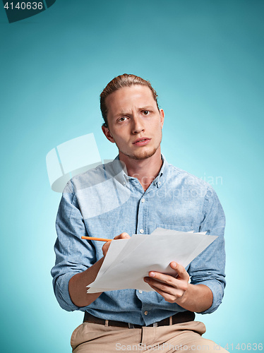 Image of Smart sad student with sheets of paper