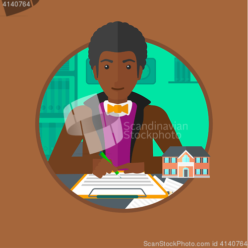 Image of Real estate agent signing contract.