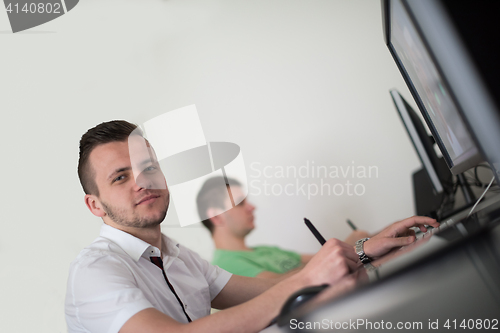 Image of a group of graphic designers at work