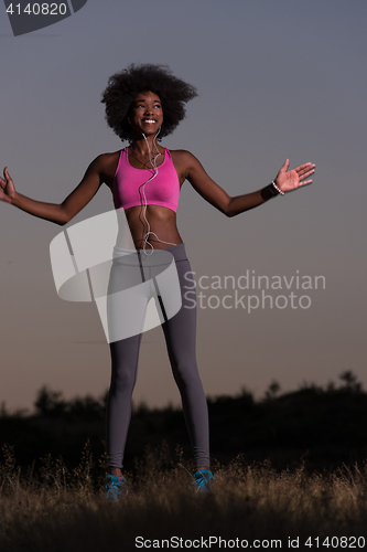 Image of black woman is doing stretching exercise relaxing and warm up