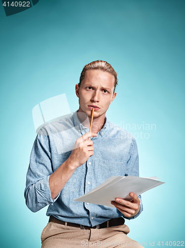 Image of Smart sad student with sheets of paper