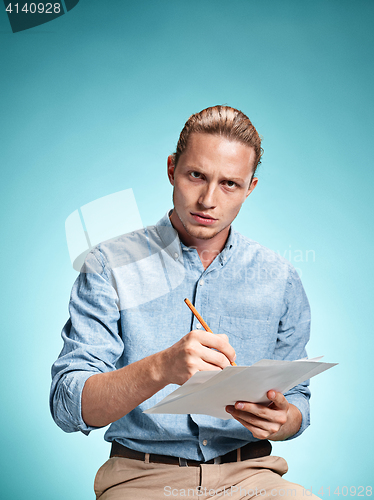 Image of Smart sad student with sheets of paper