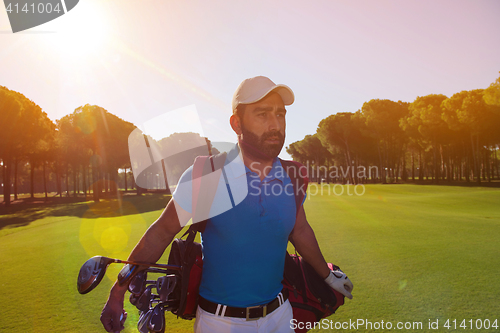 Image of handsome middle eastern golf player at the course