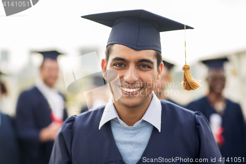 Image of happy student or bachelor in mortar board