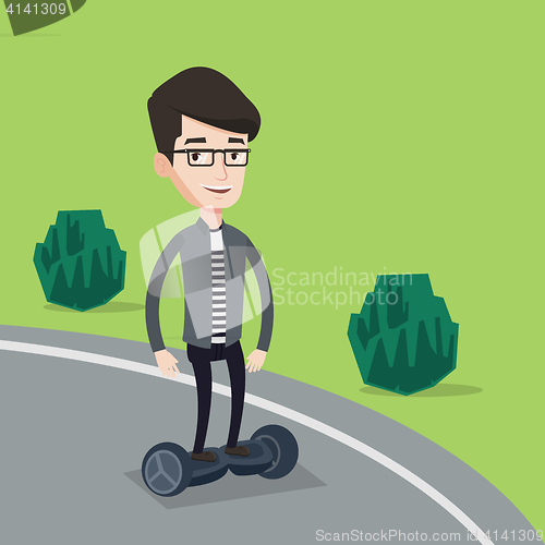 Image of Man riding on self-balancing electric scooter.