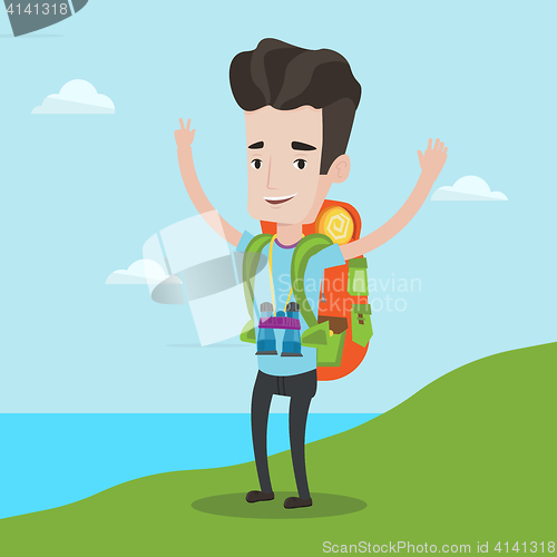 Image of Backpacker with his hands up enjoying the scenery.