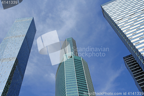 Image of Modern buildings of glass and steel skyscrapers against the sky