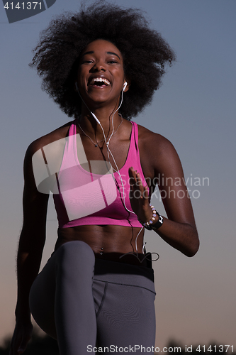 Image of black woman is doing stretching exercise relaxing and warm up