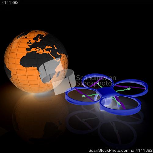 Image of Quadrocopter Drone with Earth Globe and remote controller on a w