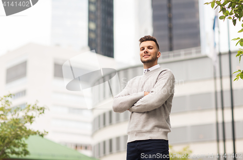 Image of young man on city street