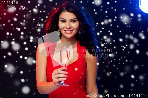 Image of beautiful woman with champagne glass at nightclub